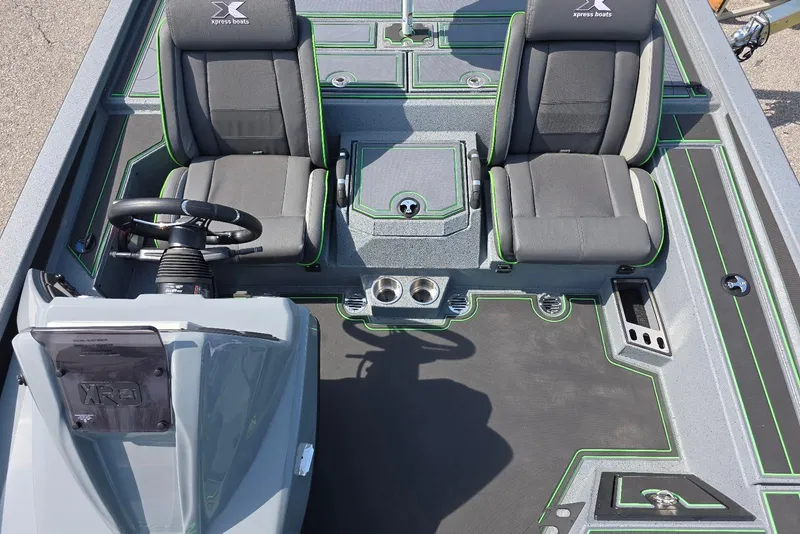 Slide: The Image of 2026 Xpress XR21 boat interior with dual seats, steering wheel, and modern design accents. - 19