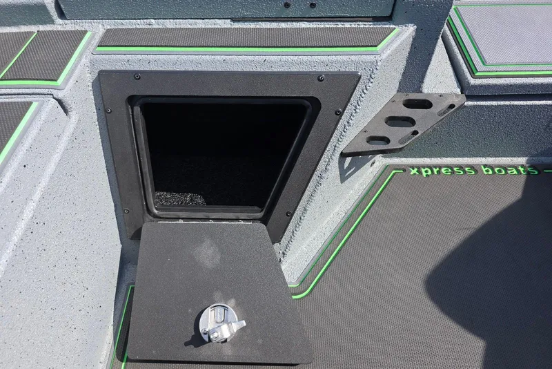 Slide: The Image of Xpress XR21 2026 boat interior with storage compartment and green accents. - 21
