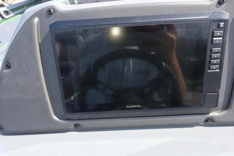 Slide: The Image of Garmin display on 2026 Xpress XR21 boat dashboard, featuring control buttons. - 23