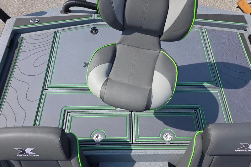 Slide: The Image of 2026 Xpress XR21 boat interior with gray and green seating and deck design. - 26