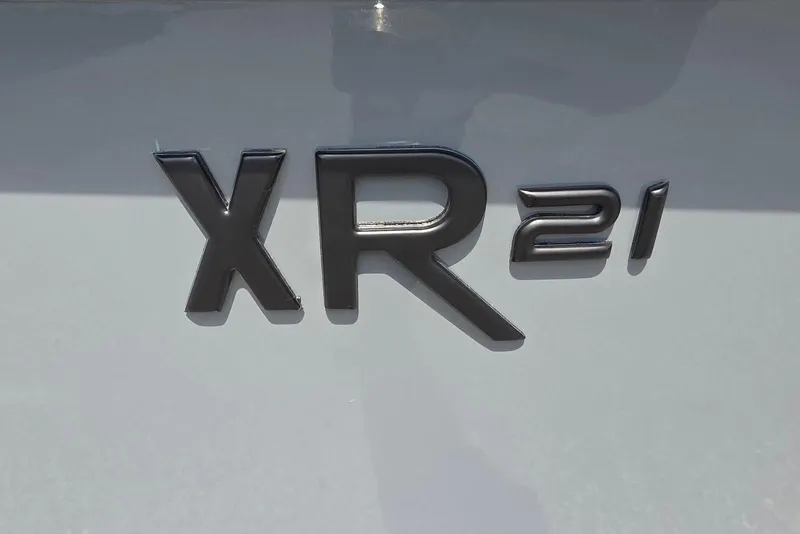Slide: The Image of 2026 Xpress XR21 logo on a sleek, reflective surface. - 4