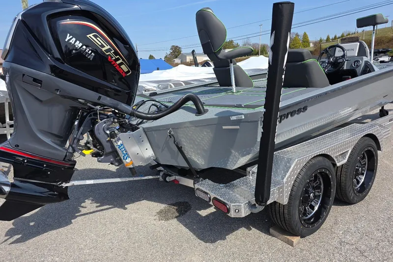 Slide: The Image of 2026 Xpress XR21 boat with Yamaha engine on a dual-axle trailer. - 5