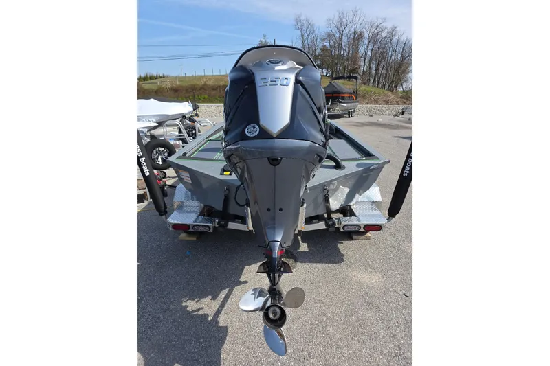 Slide: The Image of 2026 Xpress XR21 boat with powerful outboard motor on trailer. - 8