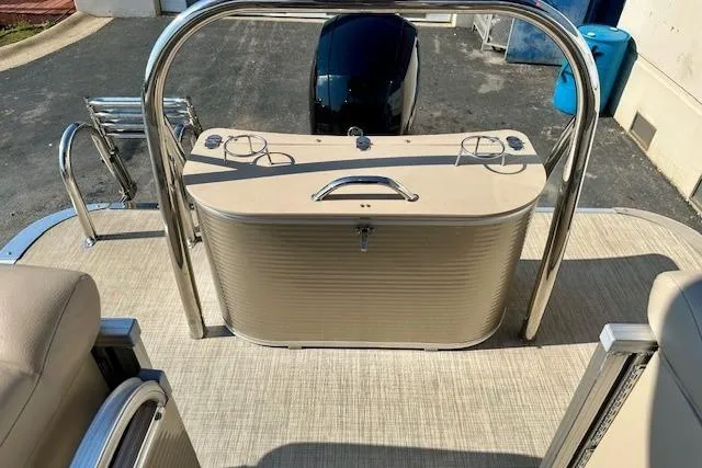 Slide: The Image of 2020 Avalon 220 Cruise boat interior with beige seating and stainless steel railings. - 12