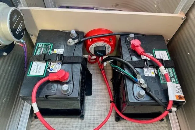 Slide: The Image of Dual batteries with wiring in a 2020 Avalon 220 Cruise boat. - 13
