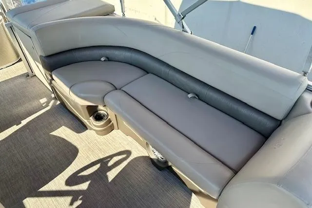 Slide: The Image of Luxurious seating on 2020 Avalon 220 Cruise pontoon boat, featuring plush upholstery and cup holders. - 7