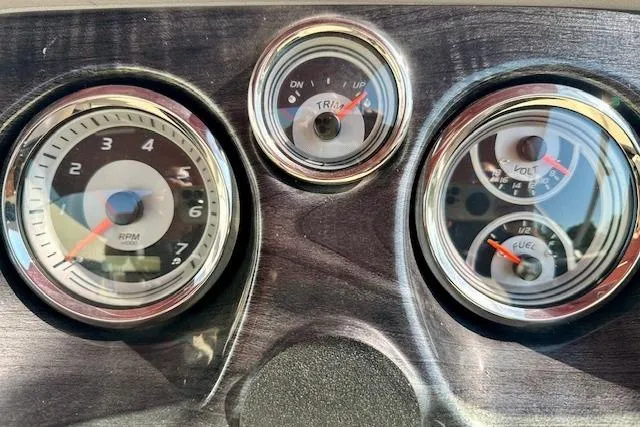 Slide: The Image of Dashboard gauges of a 2020 Avalon 220 Cruise boat, showing RPM, trim, volt, and fuel levels. - 9