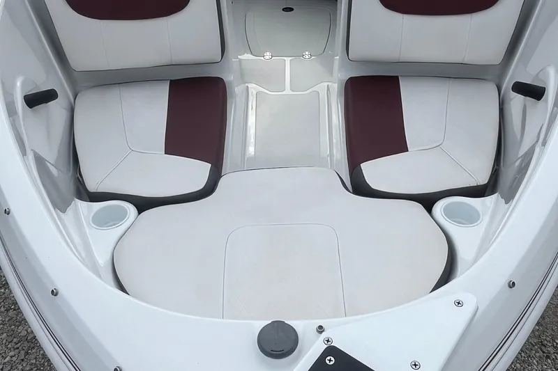 Slide: The Image of Interior seating of a 2019 Tahoe 450 TF boat, featuring white and maroon cushions. - 5