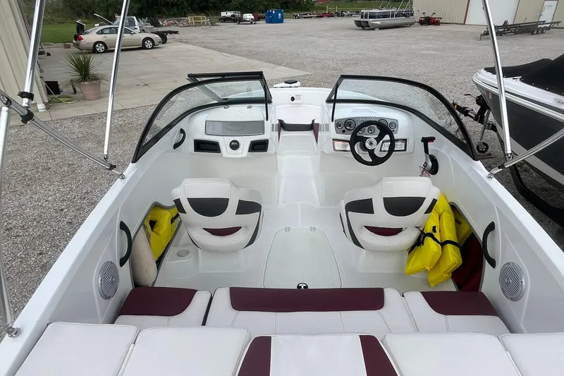 Slide: The Image of Interior of a 2019 Tahoe 450 TF boat with seating and steering wheel. - 9
