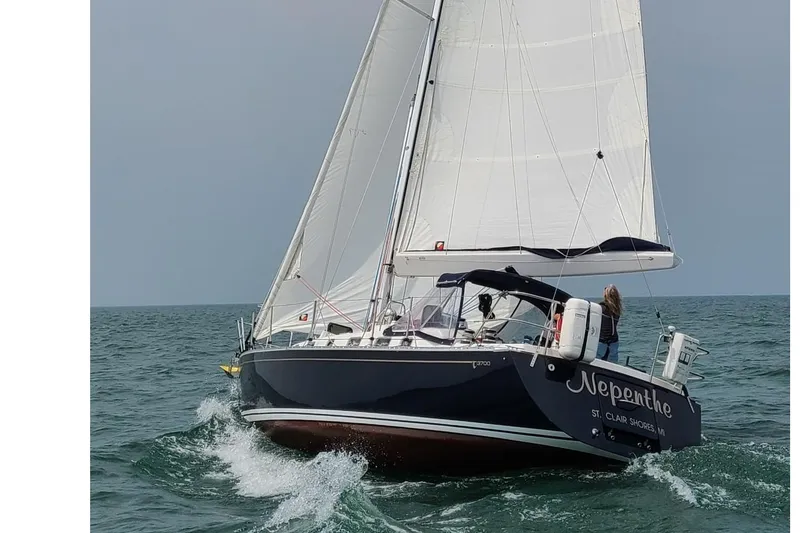 The Image of Sailing yacht Tartan 3700 CCR, 2015 model, navigating ocean waters with full sails. - 0