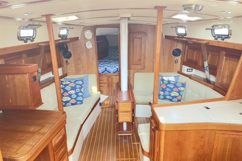 Slide: The Image of Luxurious 2015 Tartan 3700 CCR yacht interior with wood finish and cozy seating area. - 2