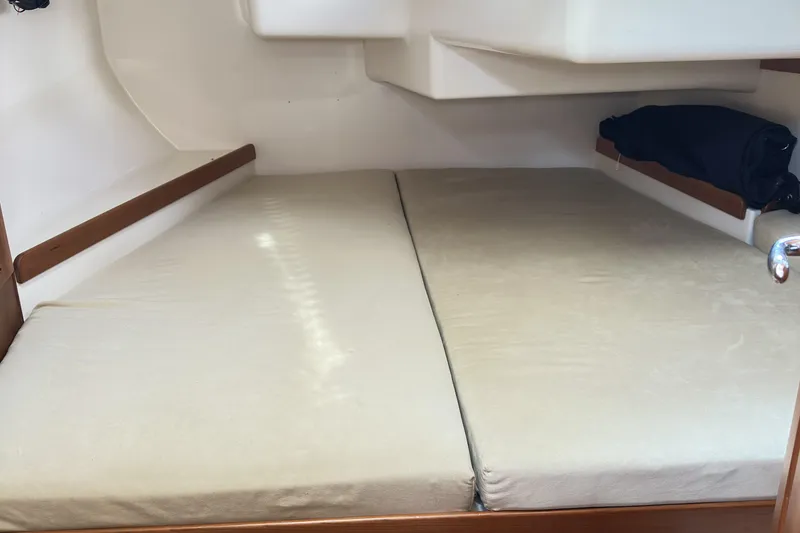 Slide: The Image of Interior cabin of a 2015 Tartan 3700 CCR sailboat with cushioned sleeping area. - 4