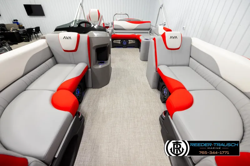 Slide: The Image of 2026 Avalon LSZ Vrl boat interior with modern red and gray seating, showcased at Reeder-Trausch Marine. - 13