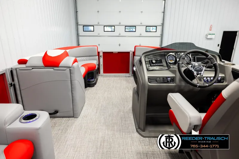 Slide: The Image of 2026 Avalon LSZ Vrl boat interior with modern dashboard and red-gray seating. - 17