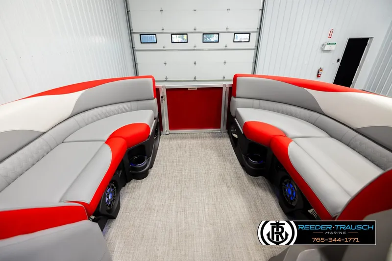 Slide: The Image of Luxurious interior of 2026 Avalon LSZ Vrl pontoon boat with red and gray seating. - 18