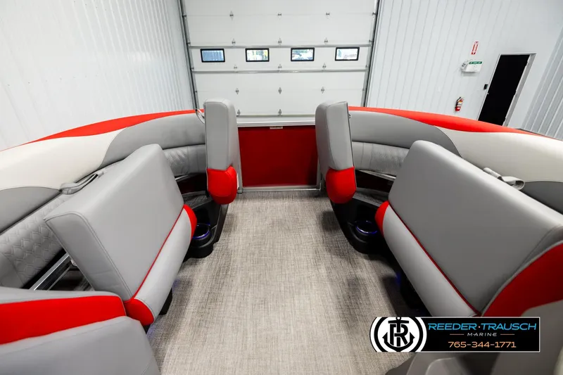 Slide: The Image of Interior of 2026 Avalon LSZ Vrl boat with red and gray seating. - 19