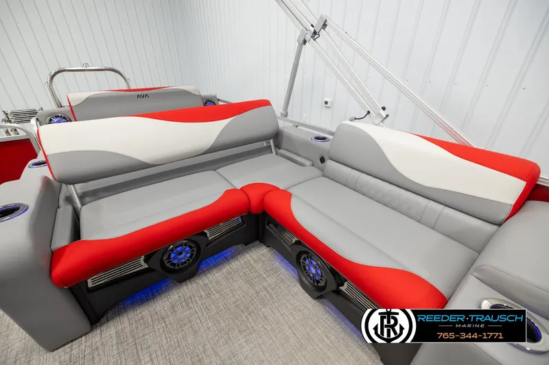 Slide: The Image of 2026 Avalon LSZ Vrl boat interior with red and gray seating, blue LED lights. - 20
