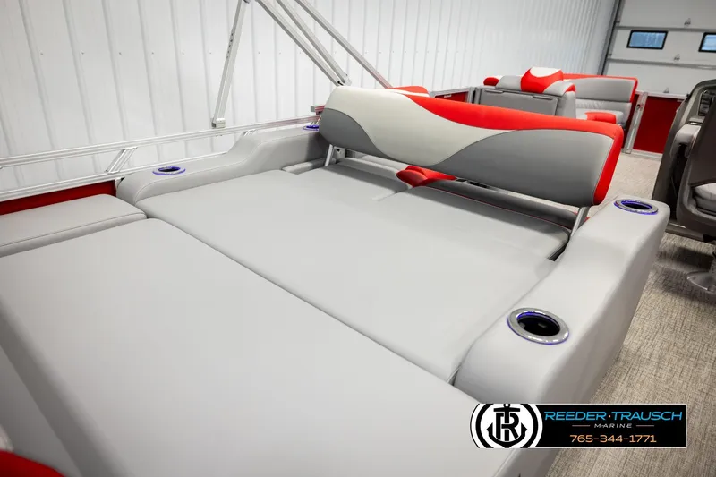 Slide: The Image of 2026 Avalon LSZ Vrl boat interior with gray and red seating, cup holders, and modern design. - 24