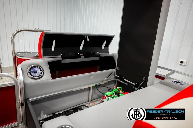 Slide: The Image of 2026 Avalon LSZ Vrl boat interior with open storage compartments and speaker system. - 26