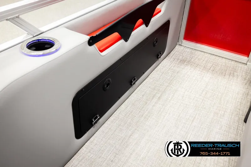 Slide: The Image of Interior of 2026 Avalon LSZ Vrl boat with cup holder and storage compartment. - 29