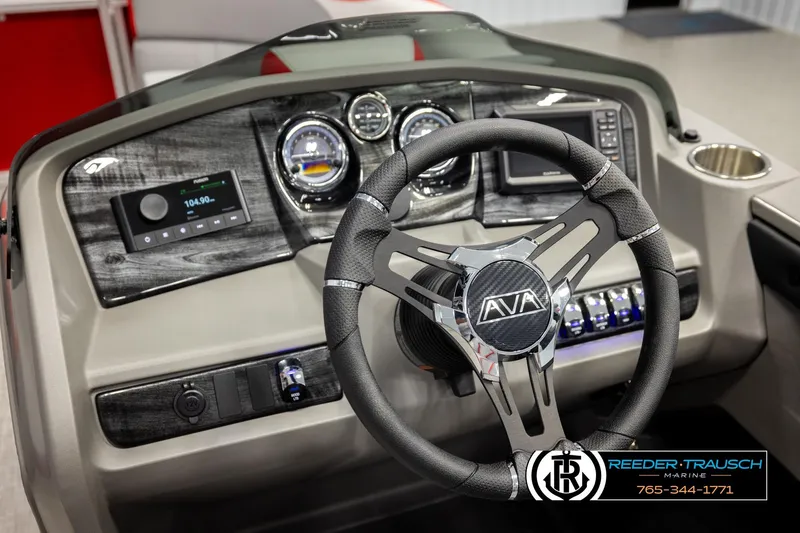 Slide: The Image of Steering wheel and dashboard of 2026 Avalon LSZ Vrl boat, featuring modern controls and gauges. - 32