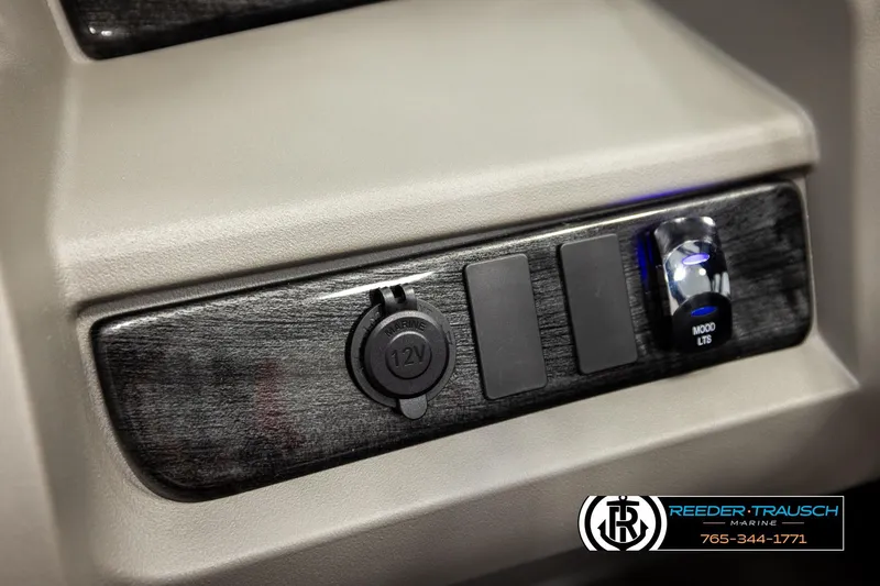 Slide: The Image of Control panel of 2026 Avalon LSZ Vrl with 12V outlet and mood lights switch. - 34