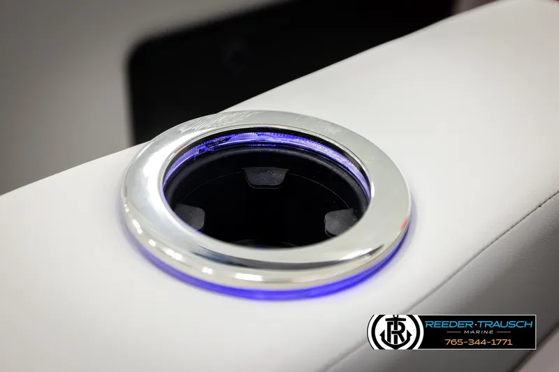 Slide: The Image of Illuminated cup holder in 2026 Avalon LSZ Vrl boat, Reeder-Trausch Marine logo visible. - 46