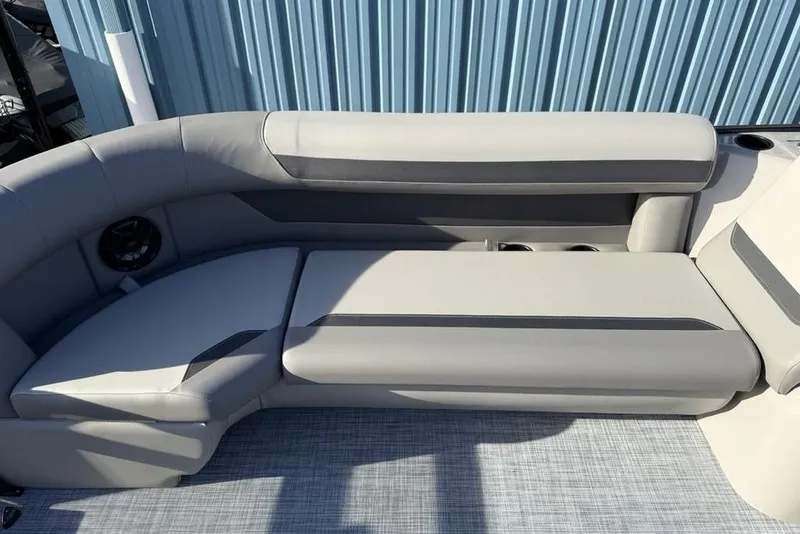 Slide: The Image of Luxurious seating on 2026 Premier 220 Sunscape RF boat, featuring sleek gray upholstery. - 10