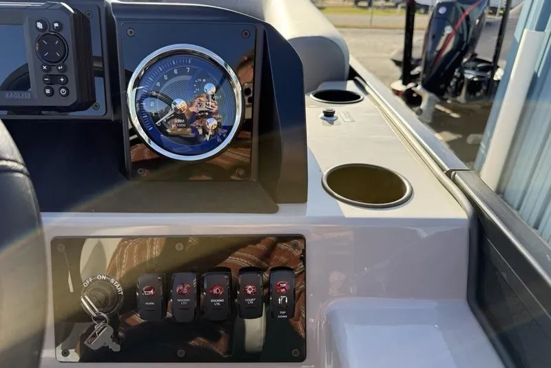 Slide: The Image of Dashboard of 2026 Premier 220 Sunscape RF boat with gauges and controls. - 13