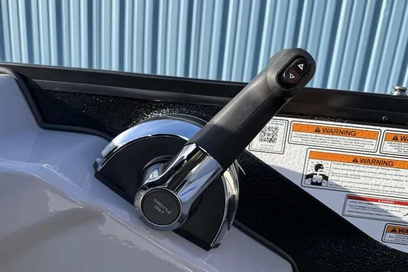 Slide: The Image of Throttle control of 2026 Premier 220 Sunscape RF boat with warning labels. - 15