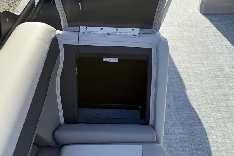 Slide: The Image of Open storage compartment in 2026 Premier 220 Sunscape RF boat interior. - 18