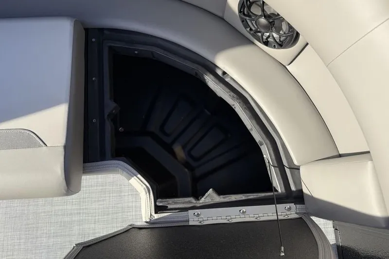 Slide: The Image of 2026 Premier 220 Sunscape RF boat interior storage compartment with speaker. - 23