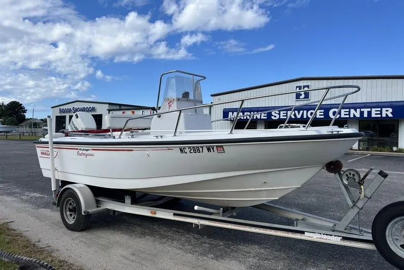 Slide: The Image of 1997 Boston Whaler Outrage 17 boat on trailer at marine service center. - 4