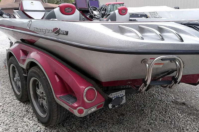 Slide: The Image of 2015 Ranger Z521C Ranger Cup boat on trailer, silver and red design. - 12