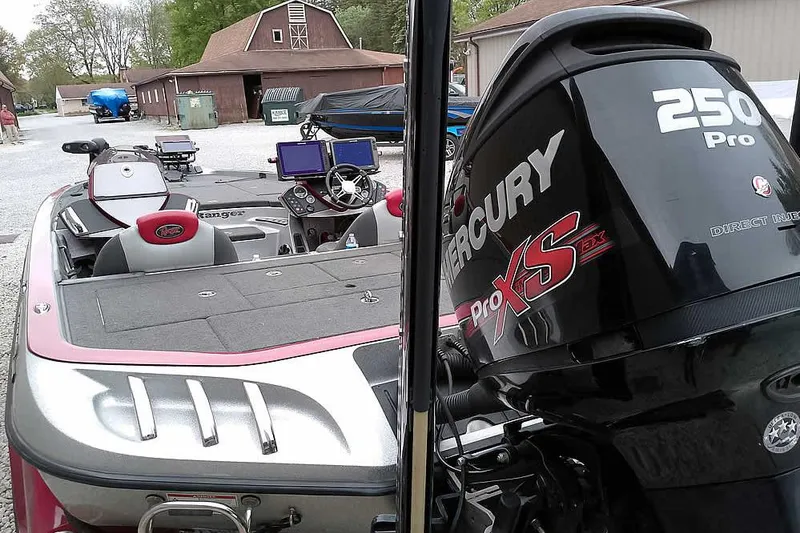 Slide: The Image of 2015 Ranger Z521C boat with Mercury 250 Pro XS engine, parked outdoors. - 2