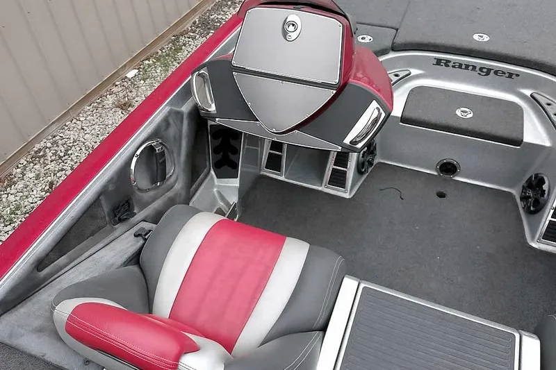 Slide: The Image of 2015 Ranger Z521C Ranger Cup boat interior with red and gray seating. - 28