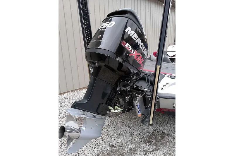 Slide: The Image of 2015 Ranger Z521C boat with Mercury Pro XS outboard motor, parked on gravel. - 3