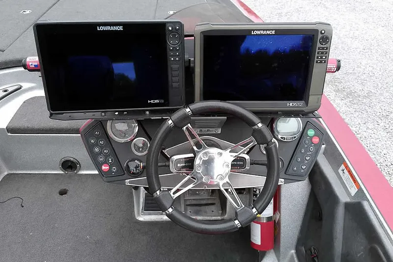 Slide: The Image of 2015 Ranger Z521C boat dashboard with dual Lowrance HDS12 displays and steering wheel. - 34