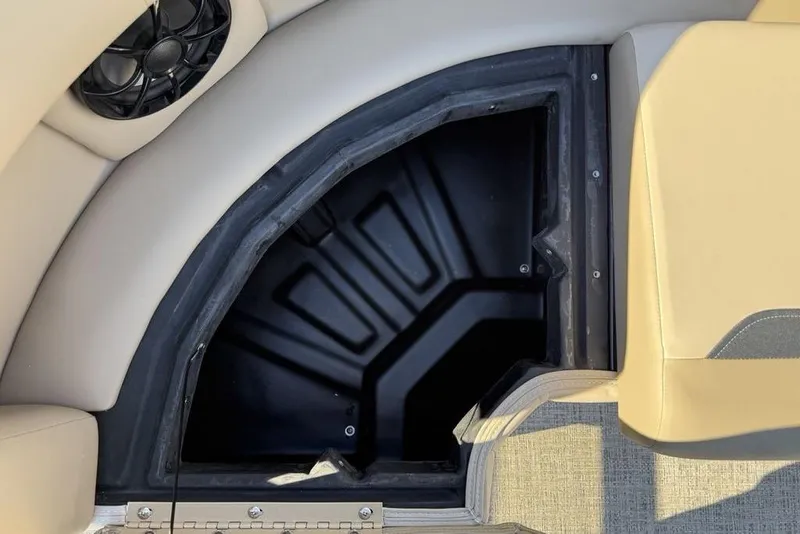 Slide: The Image of Open storage compartment in 2026 Premier 220 Sunscape RF XLC boat interior. - 11