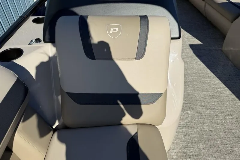 Slide: The Image of Premier 220 Sunscape RF XLC 2026 boat seat with logo, beige and black design. - 12
