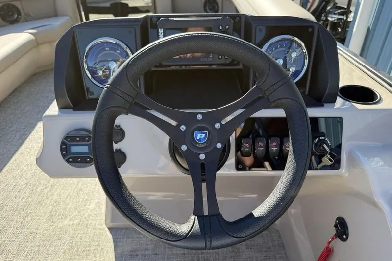 Slide: The Image of Steering wheel and dashboard of 2026 Premier 220 Sunscape RF XLC boat. - 15