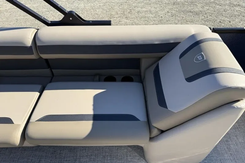Slide: The Image of 2026 Premier 220 Sunscape RF XLC boat seating with beige and gray upholstery. - 21
