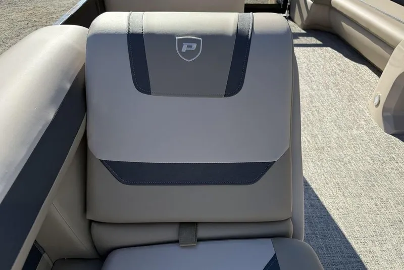 Slide: The Image of 2026 Premier 220 Sunscape RF XLC boat seat with elegant gray upholstery and logo detail. - 22