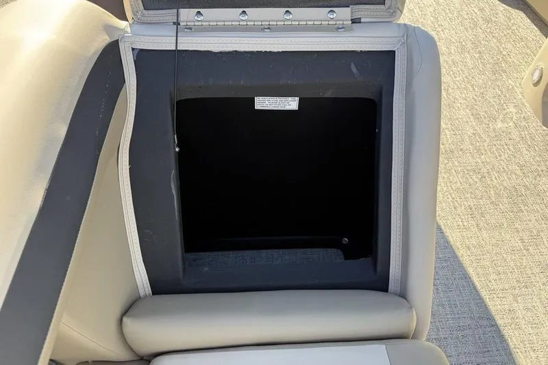 Slide: The Image of Open storage compartment in 2026 Premier 220 Sunscape RF XLC boat seat. - 24