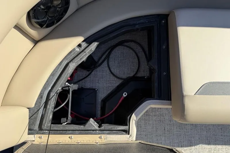 Slide: The Image of 2026 Premier 220 Sunscape RF XLC boat interior with open storage compartment and wiring. - 30