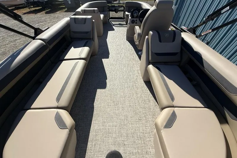 Slide: The Image of 2026 Premier 220 Sunscape RF XLC pontoon boat interior with beige seating and modern design. - 34