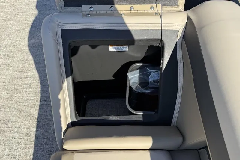 Slide: The Image of Open storage compartment in 2026 Premier 220 Sunscape RF XLC boat seat. - 7