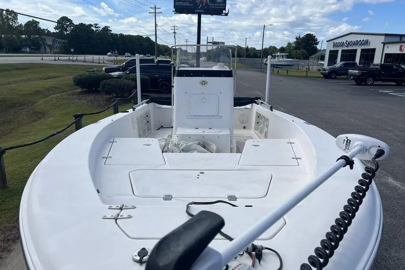 Slide: The Image of 2007 Sea Hunt BX 22 T boat with trolling motor, parked near showroom. - 12
