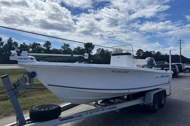Slide: The Image of 2007 Sea Hunt BX 22 T boat on trailer under cloudy sky. - 3