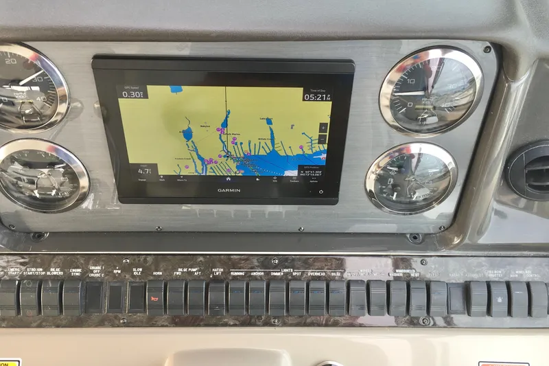 Slide: The Image of Dashboard of 2005 Sea Ray 420 Sundancer with Garmin navigation display and gauges. - 16